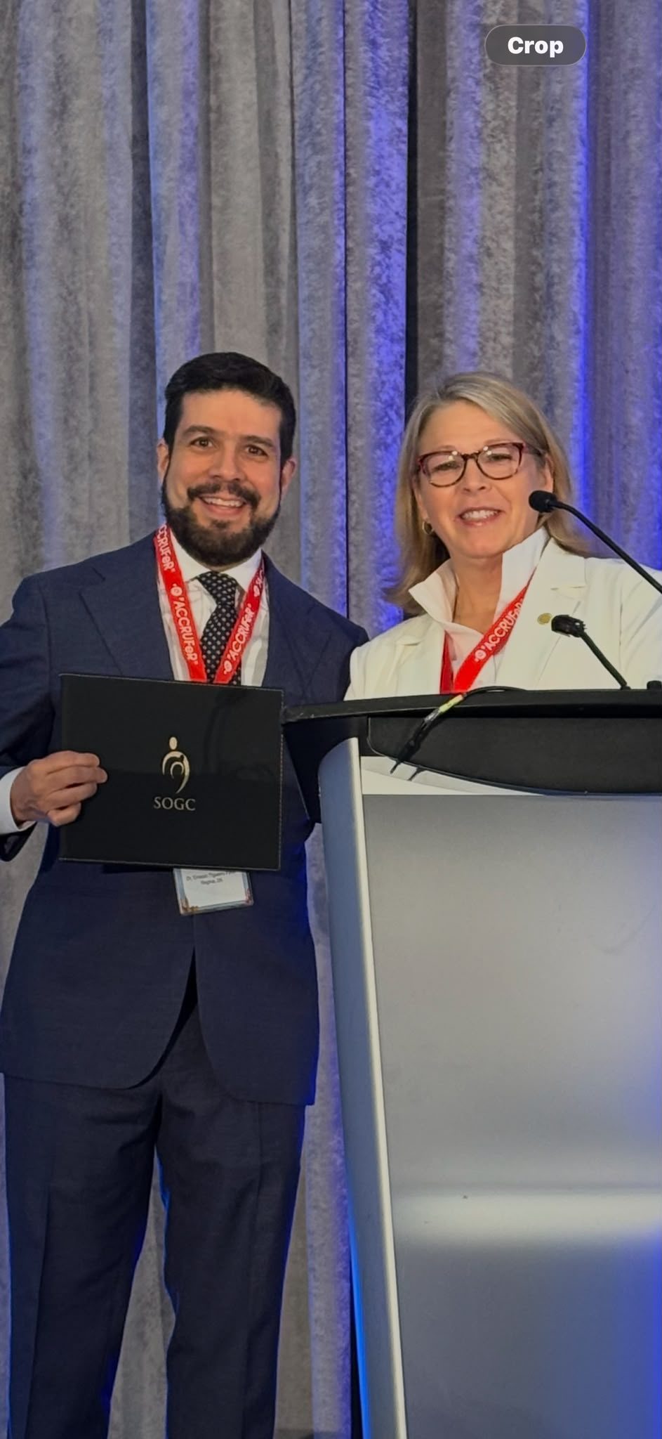 Dr. Figueiro-Filho receiving the SOGC award on stage